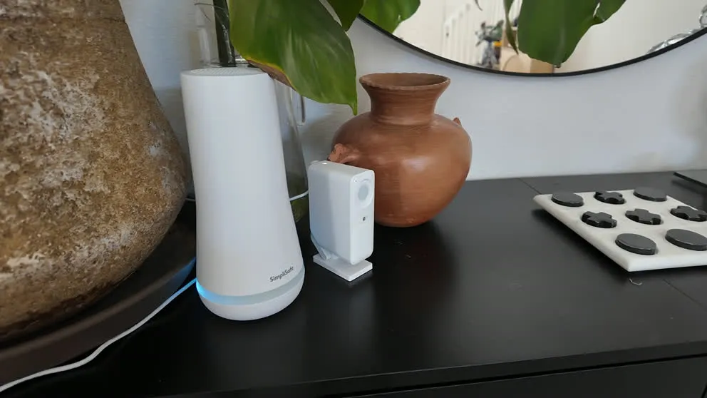 SimpliSafe base station sitting next to indoor camera