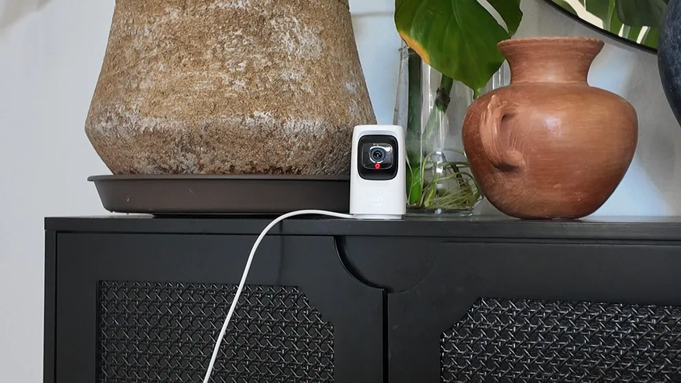 Cove indoor camera sitting on a cabinet shelf