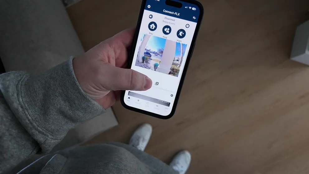 Cove Connect FLX app held in hand on a phone