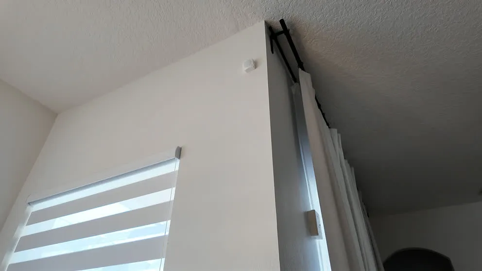 Ring motion sensor mounted on wall