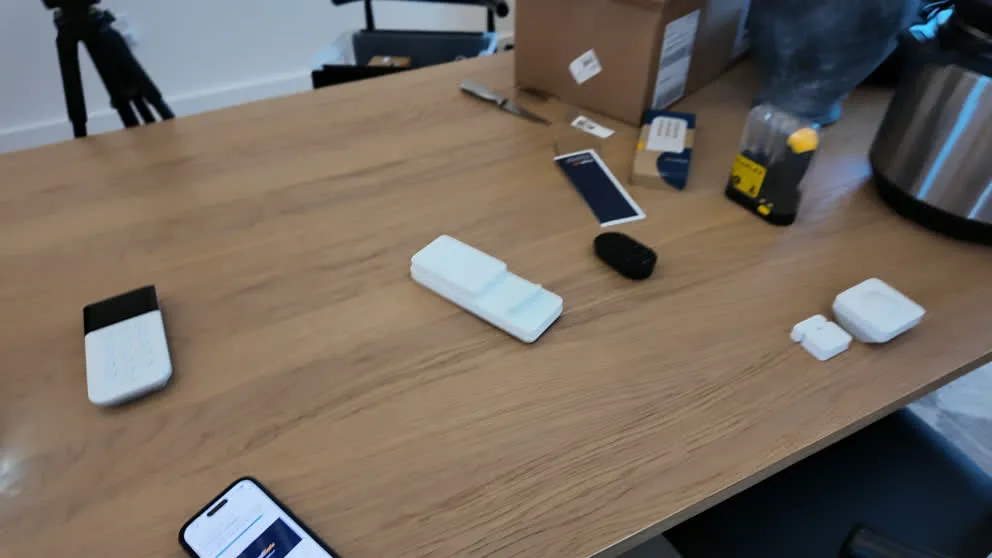 SimpliSafe sensors and components unboxed on a table